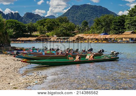 Long Tail Boats On Sunset At Song River, Vang Vieng, Laos.