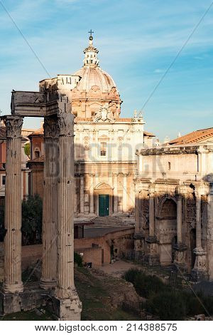 Triumphal Arch Of Septimius Severus (arco Di Settimio Severo) And Catholic Church Santi Luca E Marti