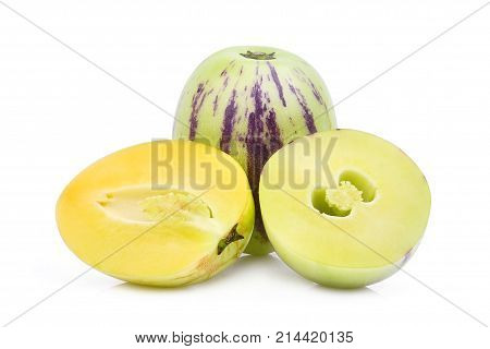 whole and half of pepino melon fruit isolated on white background