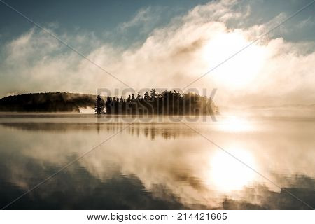 Lake of two rivers in algonquin national park ontario canada sunset sunrise with fog foggy mystical atmosphere background