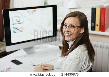Beautiful Smiling Brown-hair Business Woman In Suit And Glasses Working At Computer With Documents I