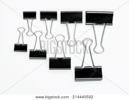 binder clips isolated on white background paper accessory black business