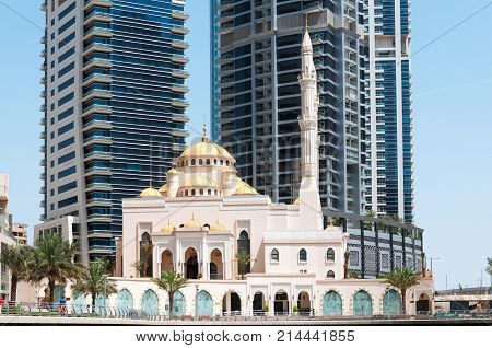 DUBAI, UAE - MAY 5, 2017: Modern buildings and Al Raheem mosque on the marina walk in Dubai Marina on may 5, 2017 Dubai, UAE.