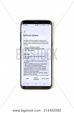 MONTREAL CANADA - NOVEMBER 12 2017: Samsung S8 Software update information on the screen. Samsung Galaxy S8 is one of the most popular cell phones.