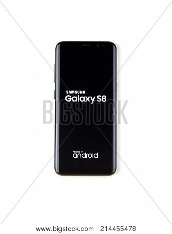 MONTREAL CANADA - NOVEMBER 12 2017: New black Samsung Galaxy s8 with logo on the screen over a white background.