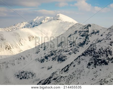 View of the highest mountain in the Low Tatras - Dumbier from of Chopok mountain in winter Slovakia