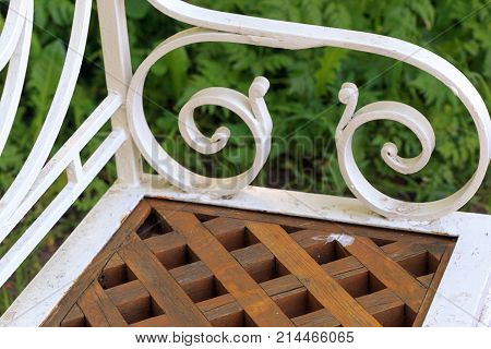 white openwork metal bench. Architectural seating solution