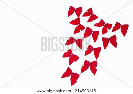 Red bows on a white background with space for text