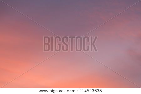 Dramatic sunset sky with warm colors in magenta orange yellow and pink