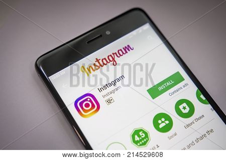Berlin Germany - November 19 2017: Instagram application on screen of modern smartphone close-up. Instagramm app in Play Store in install menu.