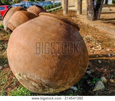 Several large pythari jars abandoned in the car park at Omodos Cyprus