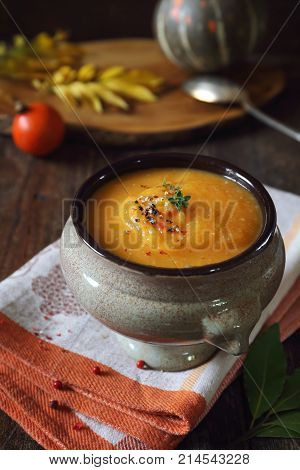 Vegetable pumpkin cream soup. Rustic style, autumn food