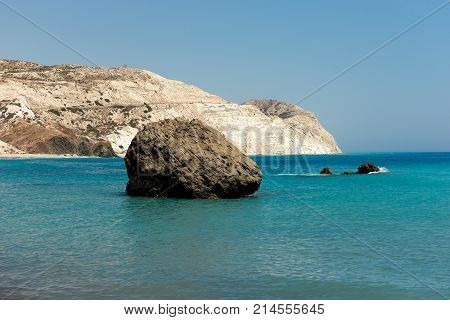 A large rock in a sea near Aphrodite rock in Cyprus between Limassol and Paphos