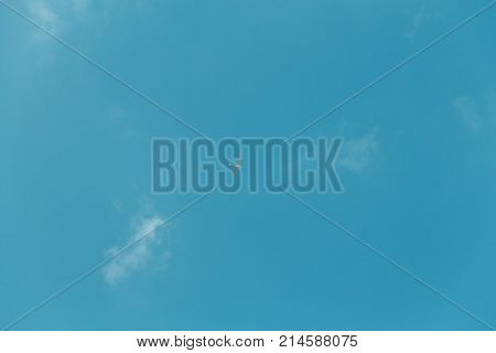 Glider Gliding In Blue Sky From Below