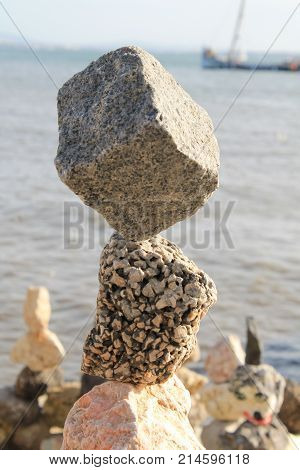 Stones by the sea doing Yoga in lisbon