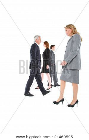 businessman and businesswoman walking in different directions