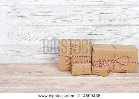 Gift box on the wooden background. Red ribbon. Valentine Day gift.