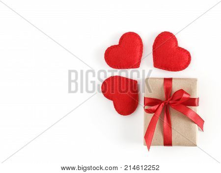 Valentine's day card with gift are red hearts isolated on white background with copyspace