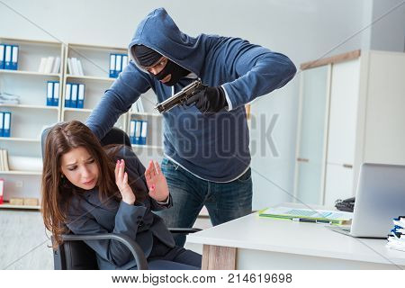 Criminal taking businesswoman as hostage in office