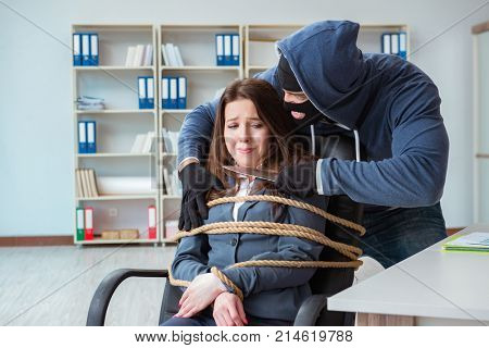 Criminal taking businesswoman as hostage in office