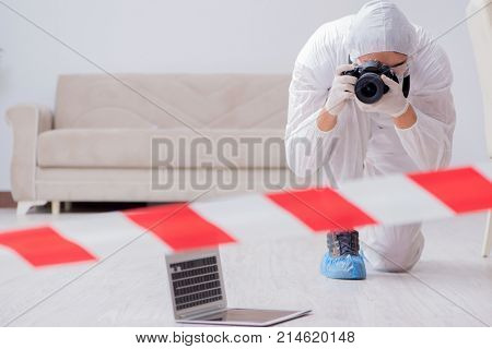 Forensic expert at crime scene doing investigation