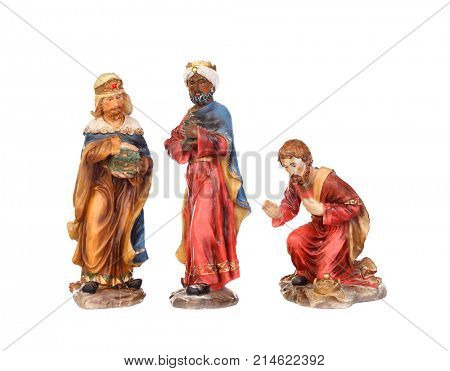 The three wise men. Ceramic figures isolated on white background