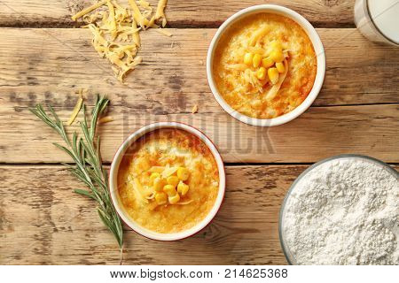 Ramekins with corn pudding on table