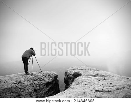 Wildlife Photographer On Mountain Summit Works. Man Like To Travel And Photography, Taking Pictures