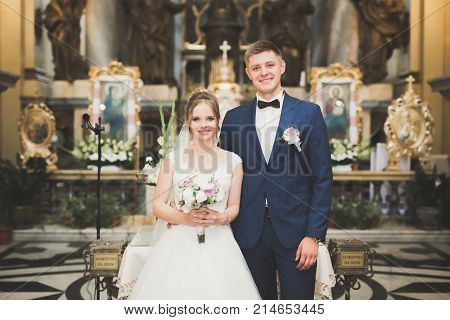 Wedding couple bide and groom get married in a church.