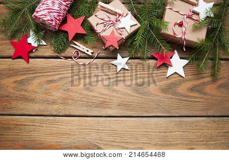 Christmas gift boxes and decorations on wooden background