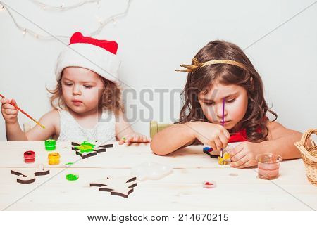 Two beautiful girls  painted wooden Christmas figurines