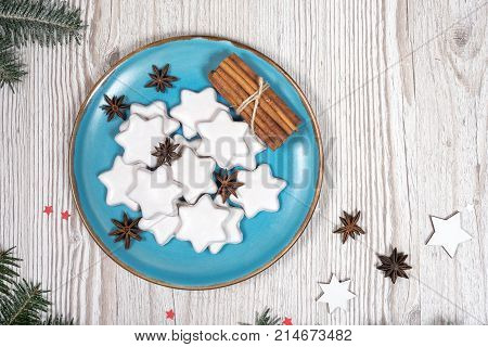 Christmas plate with cakes. background on the wooden desk