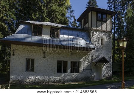 Majestic ancient  building of Hydroelectric plant in the old park Tsarska or Royal Bistritsa  near by  resort  Borovets, Rila mountain, Bulgaria