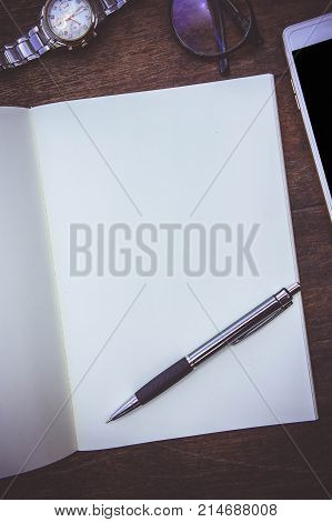 Blank Paper Book On the wood working table Warm coffee Wait for creative time to start papeer blank for text background
