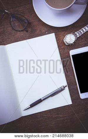 Blank Paper Book On the wood working table Warm coffee Wait for creative time to start papeer blank for text background