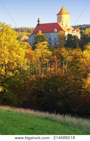 Beautiful castle Veveri in colorful autumn nature gold leaf Czech republic