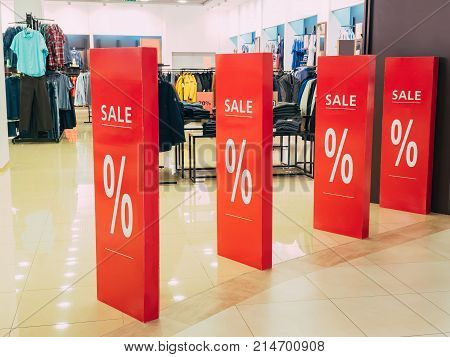 seasonal discounts in the store. text sale in a shop entrance. black friday in store, discount shop.