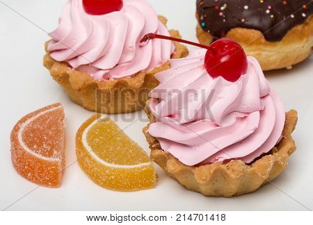 Delicious Cakes With Cherry And Creme, Berliner Donut With Chocolate, Pair Of Slices Of Marmalade, I