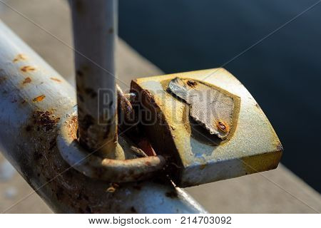 Close-Up Of Beautiful And Romantic Love Lock With Heart Symbol On Bridge During Sunset