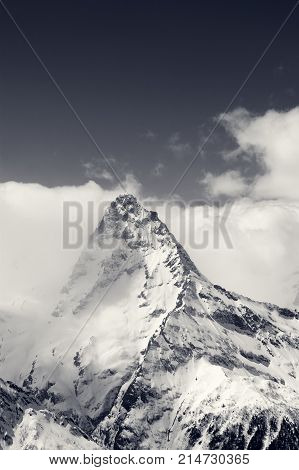 Black And White Snowy Mountains In Clouds