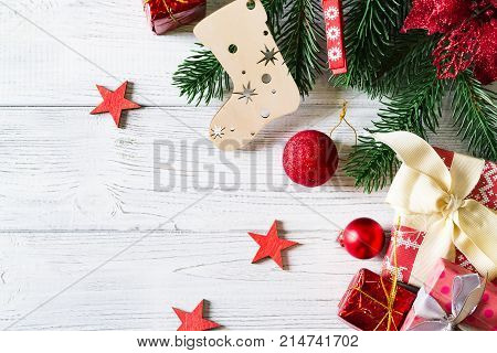 beautiful christmas background with gift boxes balls christmas ornaments and christmas tree branches copy space