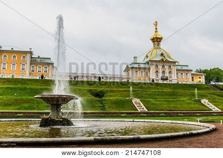 Saint Petersburg, Russia - Circa June 2017: Grand cascade in Pertergof or Peterhof in St. Petersburg, known as Petrodvorets from 1944 to 1997. Famous tourist place with golden statues