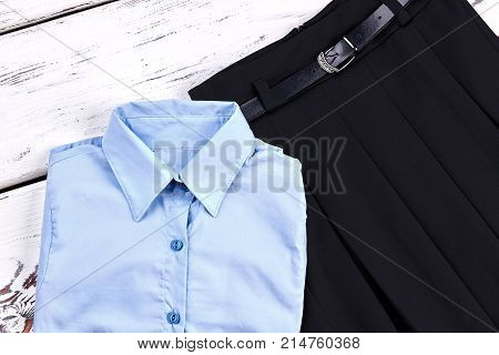 Set of stylish uniform for school girl. Girls new elegant shirt and skirt for school wear. Classic school apparel for girls.
