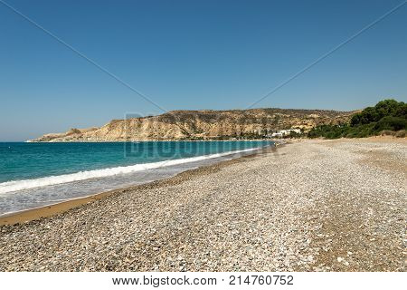 Pissouri, Cyprus, July 2017: A view to Pissouri Bay pebble beach in a sunny summer day between Limassol and Paphos