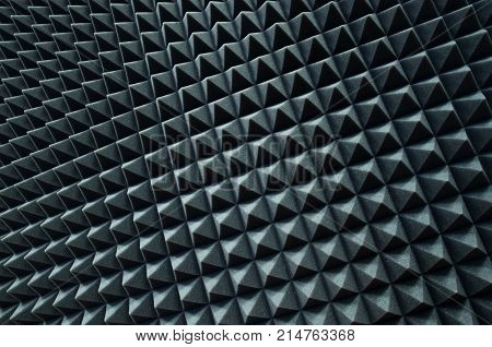 Close up of pyramids of sound proof coverage in recording studio.