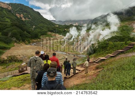 Kamchatka Peninsula, Russia - August 12, 2016: Tourists on an excursion in the Famous Valley of Geysers. Kronotsky Nature Reserve on Kamchatka Peninsula.