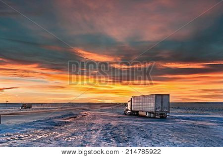 lonely traveler at sunset on the truck stop