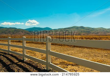 fence separates coziness and wildlife in Сolorado