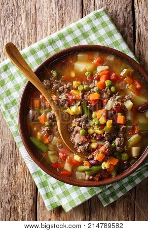 Hamburger Soup With Ground Beef And Vegetables Close-up In A Bowl. Vertical Top View