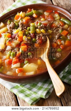 Hamburger Soup With Ground Beef And Vegetables Close-up In A Bowl. Vertical